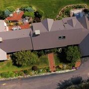 Arial View from drone of a Cedar Shake Metal Roof overlooking property