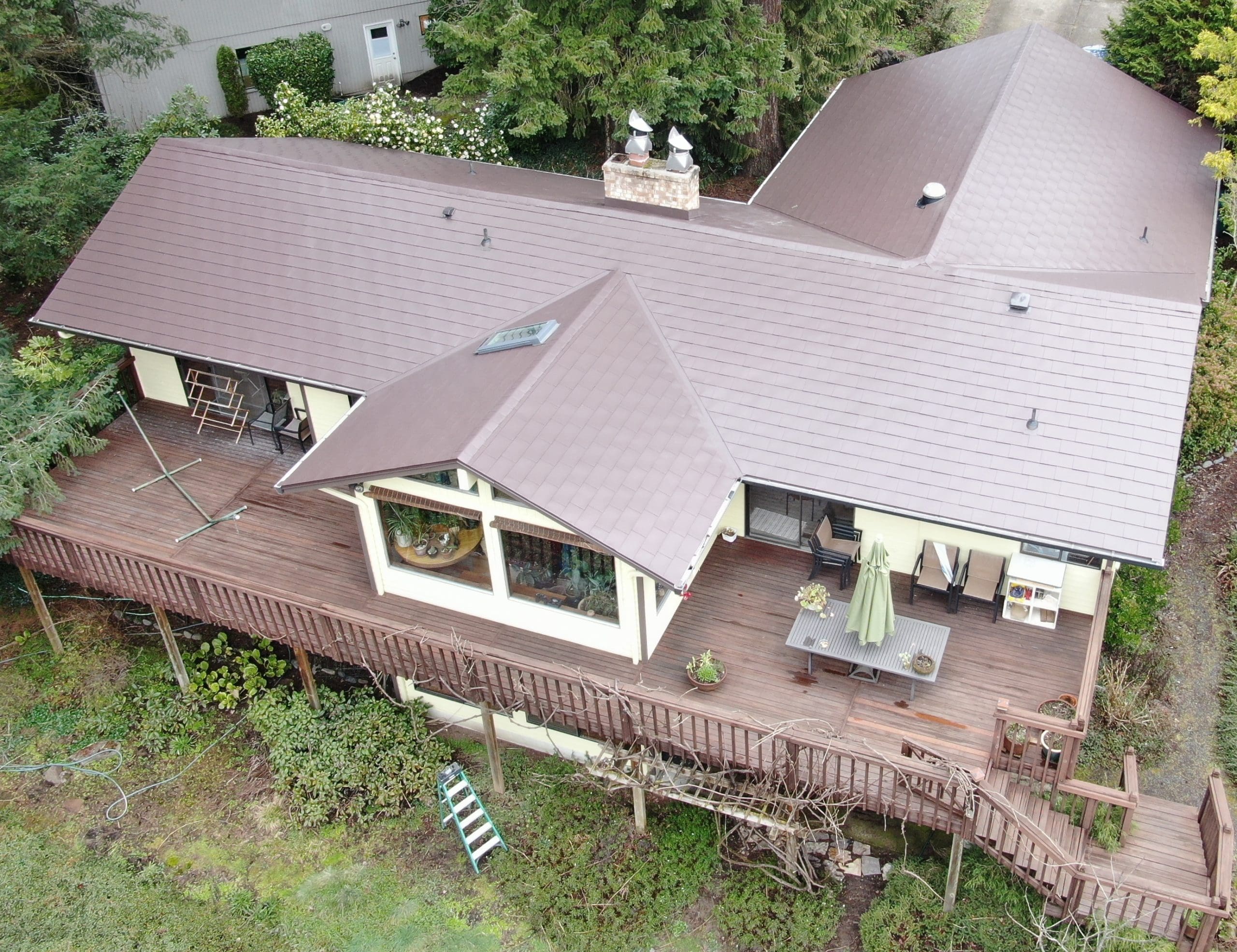 Smooth Regal Brown Slate Shingleon a home with huge back deck