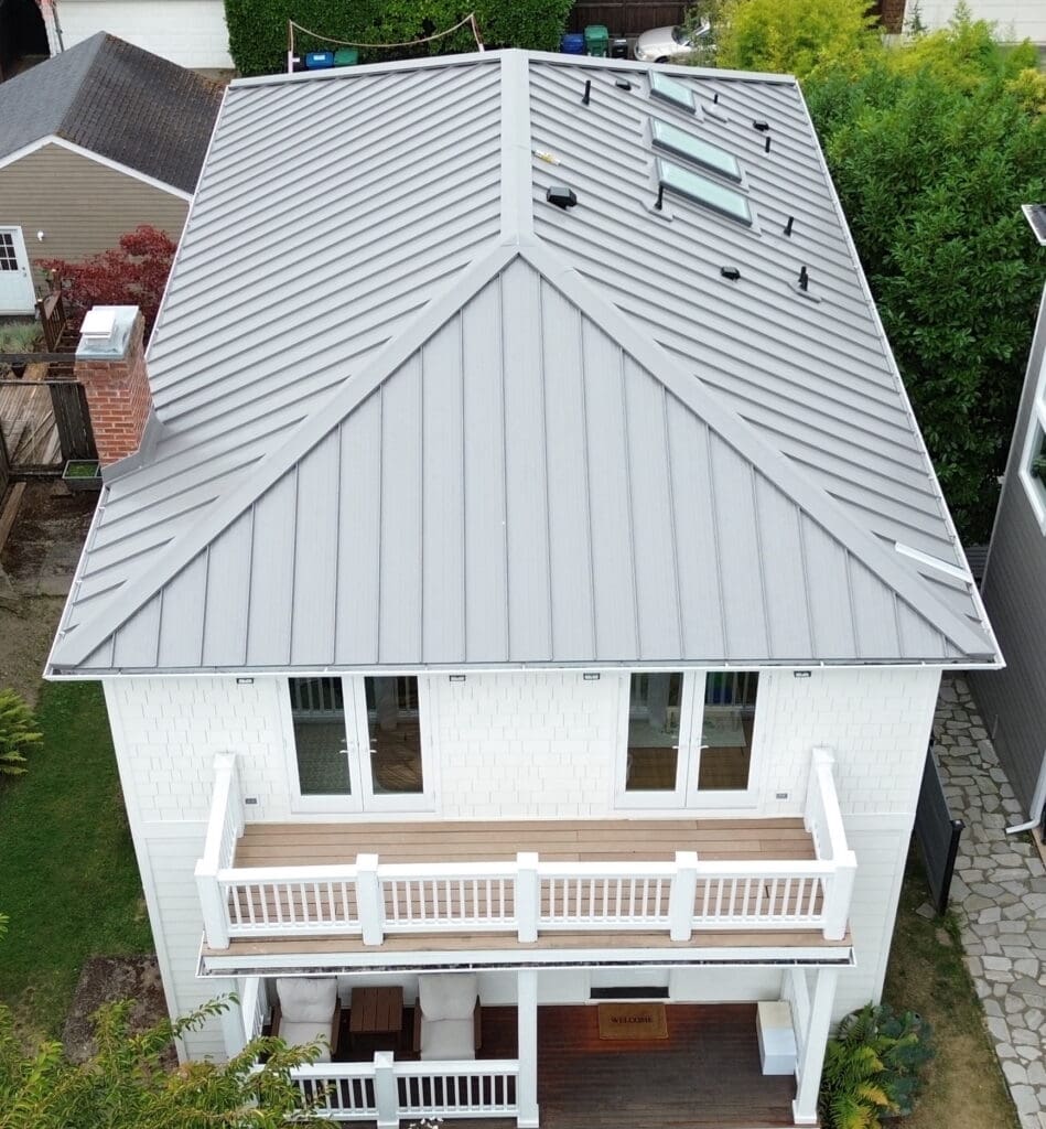 Image of a white, two story  home with metal roofing to help illustrate metal roofing Hillsboro