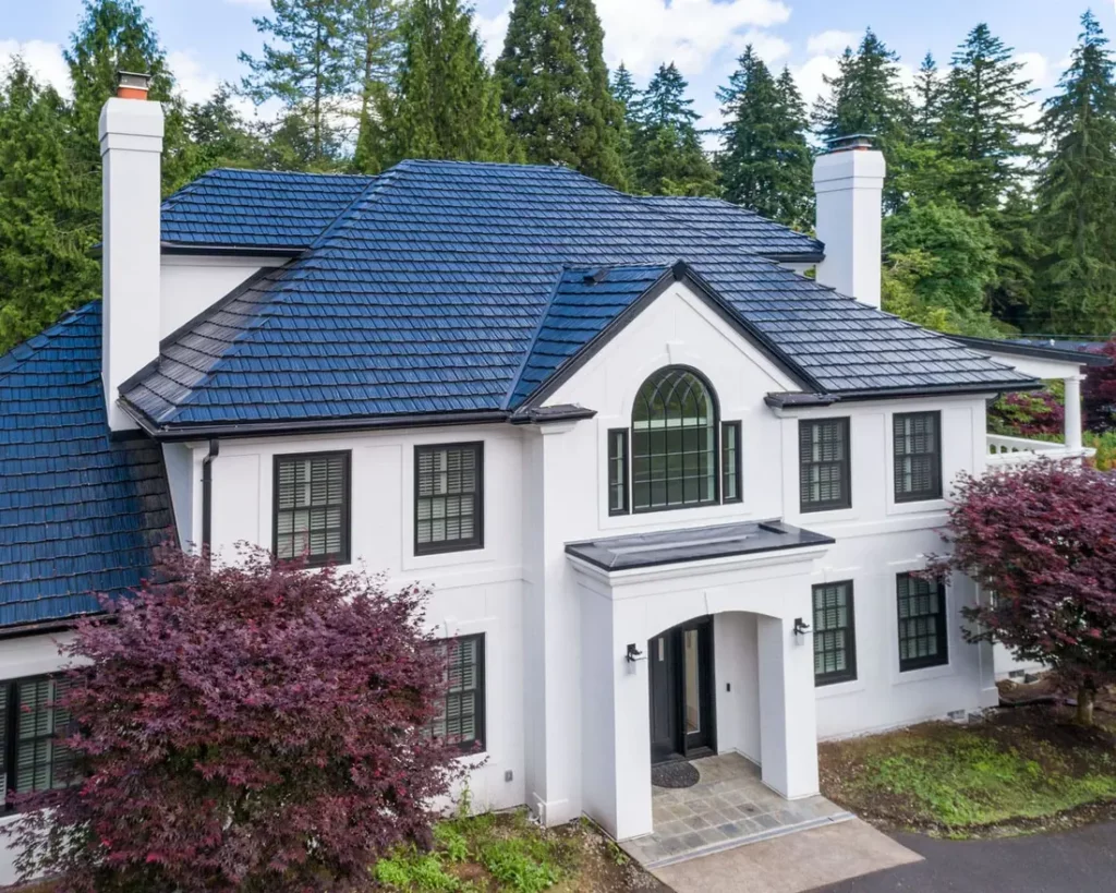 Beautiful white with new blue metal roofing